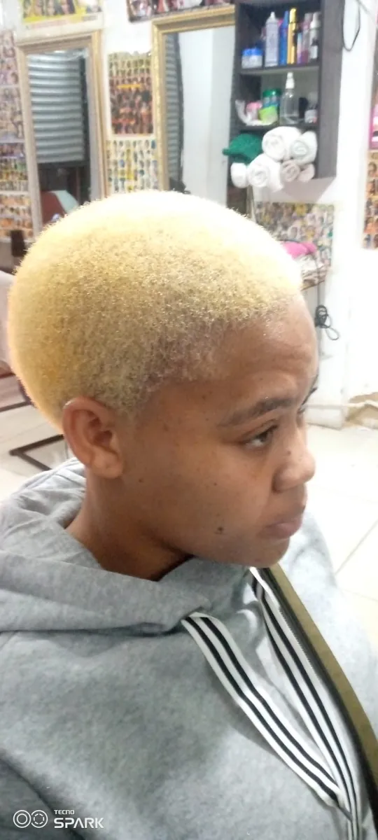 Short bleached blonde hair with faded sides