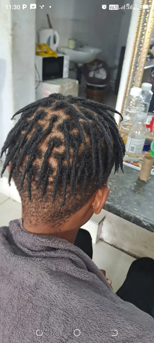 Back of the head showing new locs with clean partings